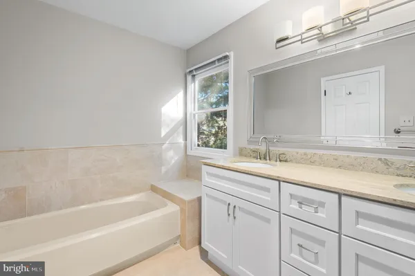 a bathroom with a bathtub and a sink