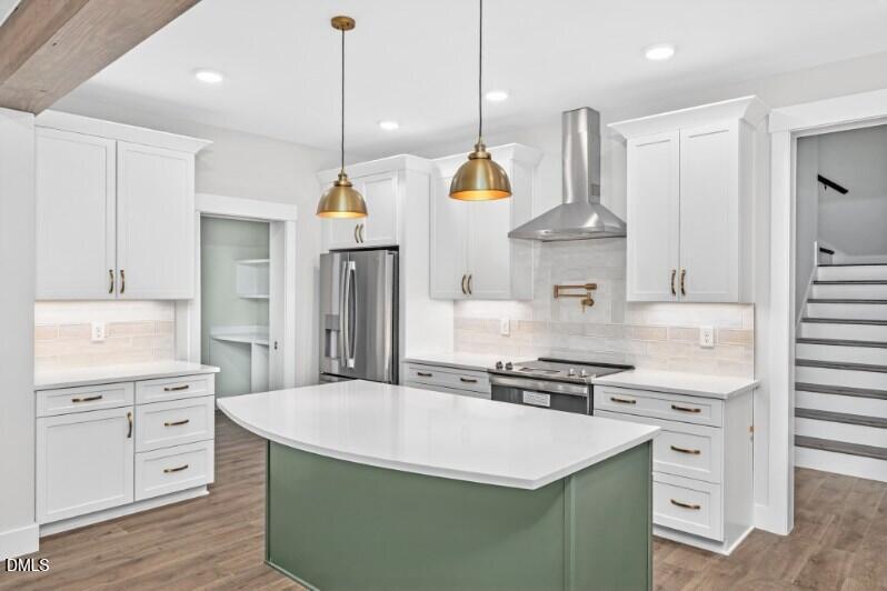 8 Trey Point Dr Spring Spring Hope, NC 27882 - Photo 4 of 31 a kitchen with stainless steel appliances kitchen island granite countertop a stove a sink a refrigerator and a wooden cabinets