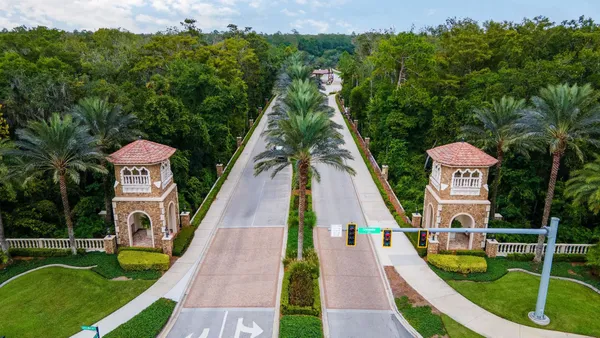 swimming pool view with a garden and trees