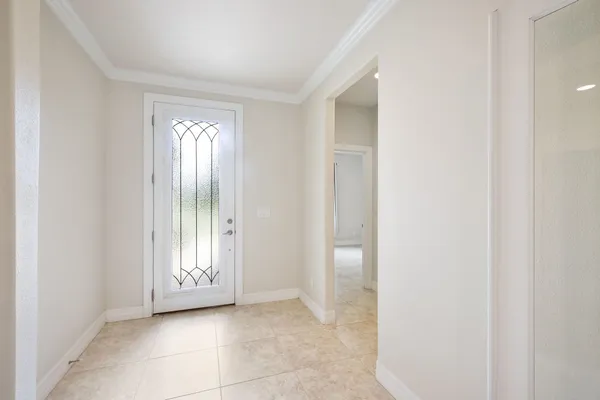 a view of an empty room and a window