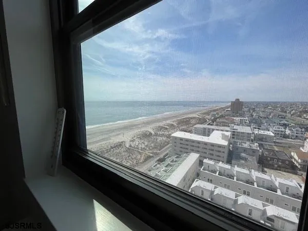 a kitchen with white cabinets stainless steel appliances and sink