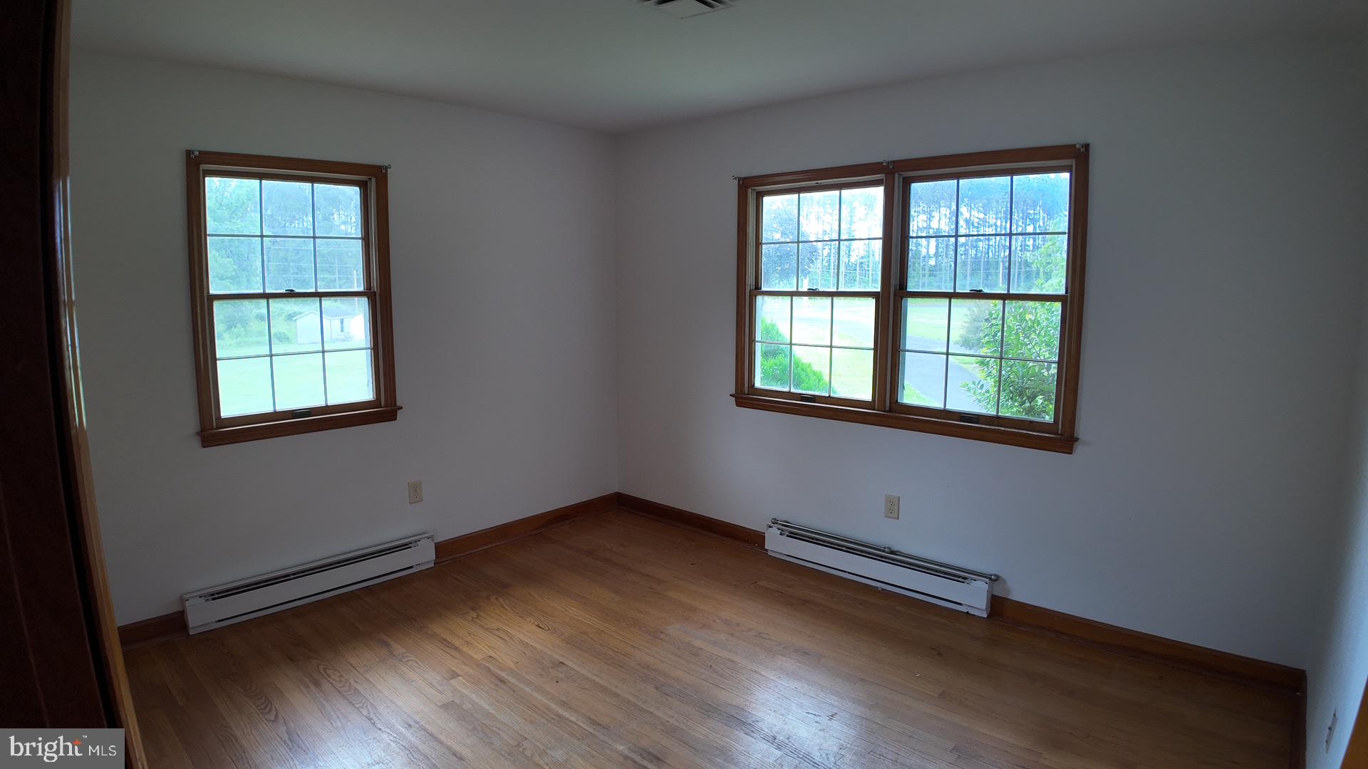 8936 Goldsborough Neck Road Easton, MD 21601 - Photo 12 of 13 an empty room with a window