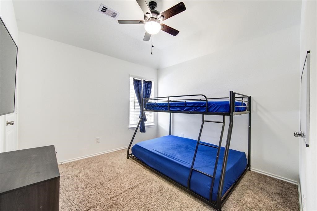 25519 Pitchfork Ranch Place Katy, TX 77493 - Photo 24 of 31 a view of livingroom with furniture and cabinet
