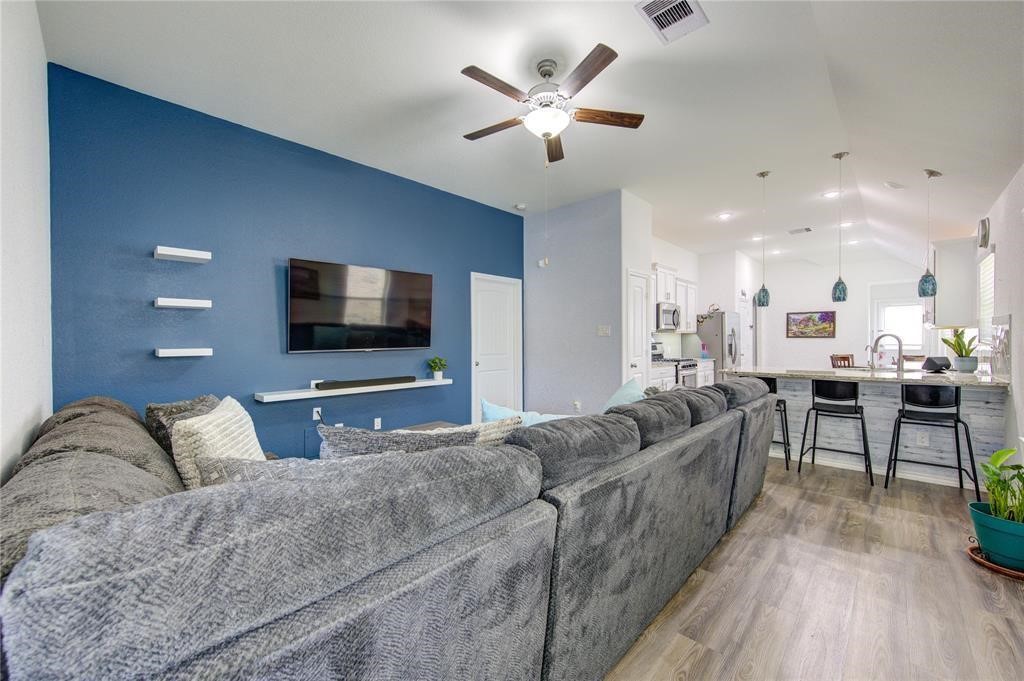 25519 Pitchfork Ranch Place Katy, TX 77493 - Photo 5 of 31 a living room with furniture and a flat screen tv