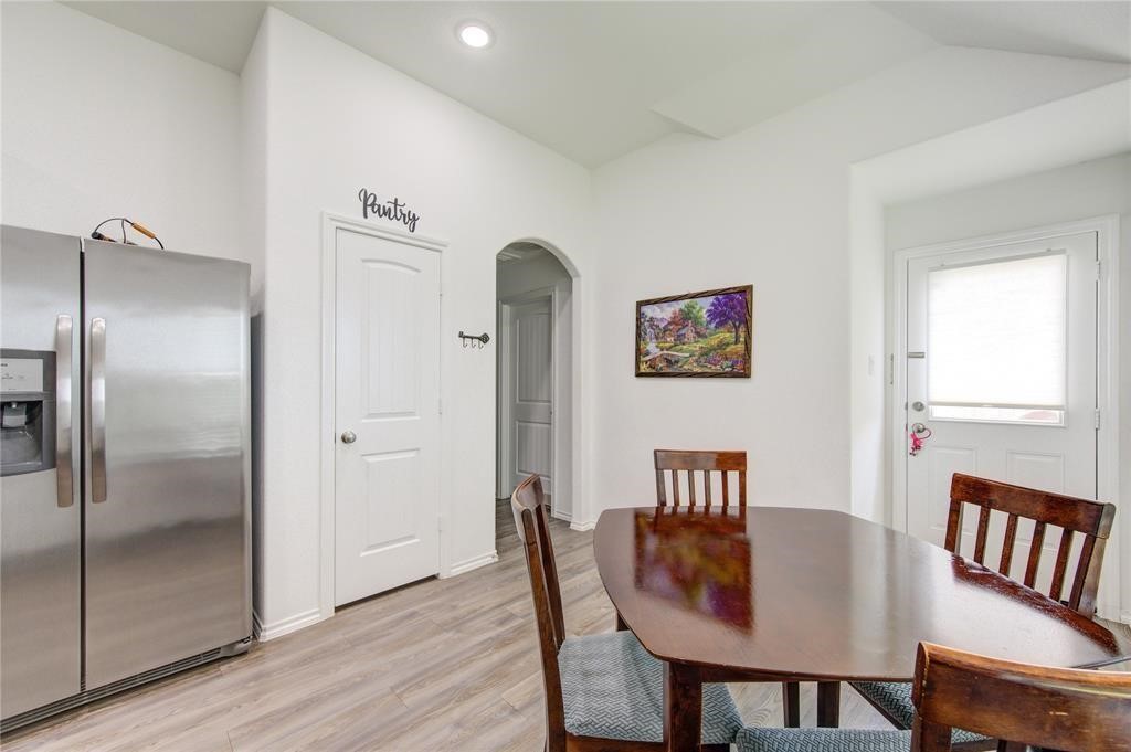25519 Pitchfork Ranch Place Katy, TX 77493 - Photo 10 of 31 a view of a dining room with furniture window and wooden floor