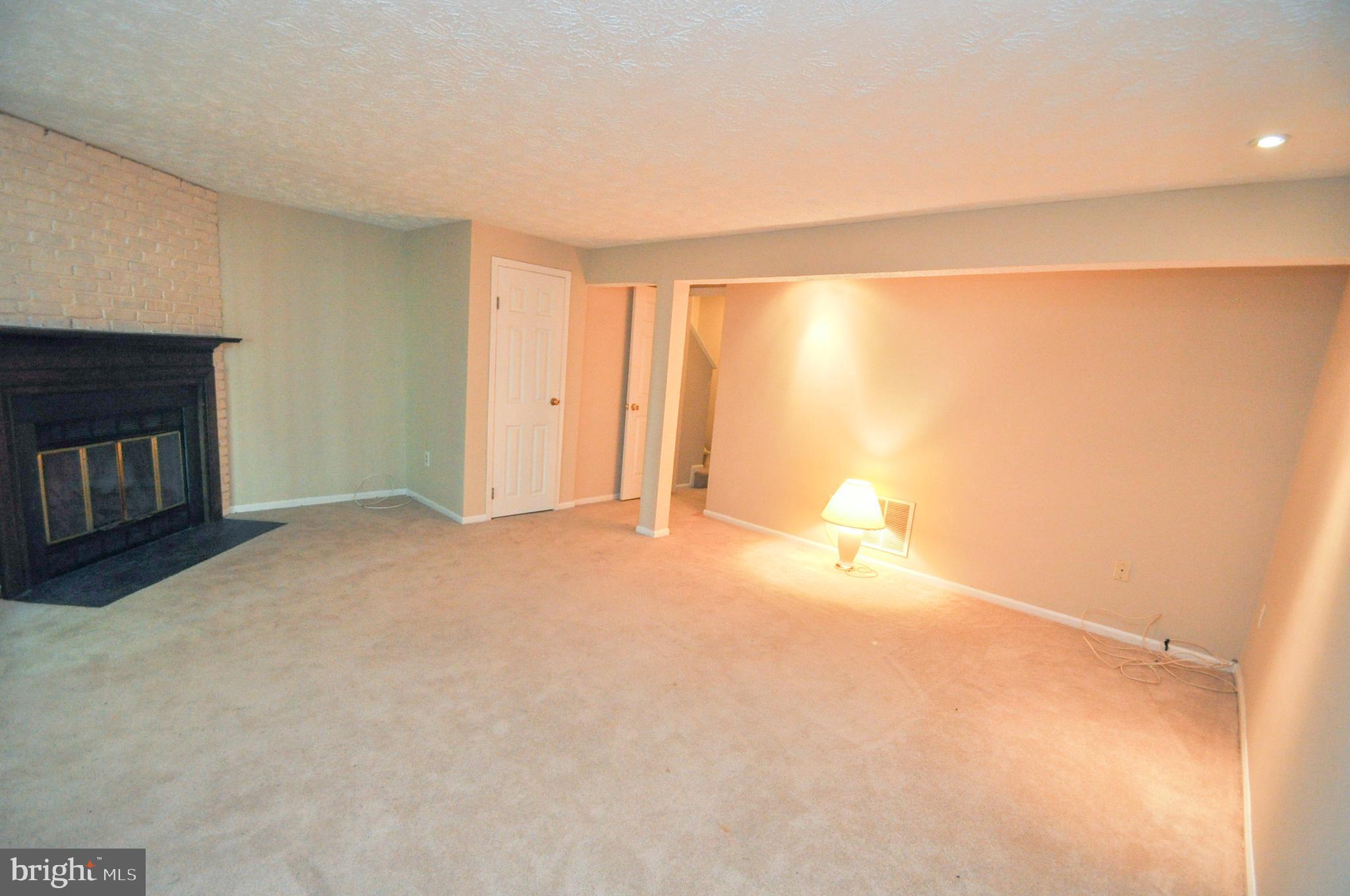 17 Greenleaf Road Baltimore, MD 21234 - Photo 19 of 28 Lower level family room w/wood burning fireplace