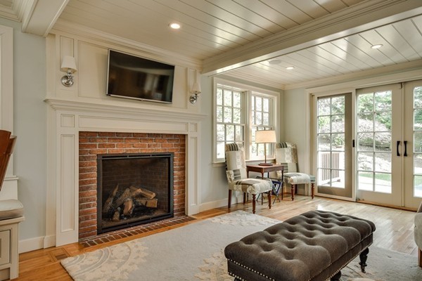 21 Fox Hill Road Wellesley, MA 02481 - Photo 6 of 30 a living room with furniture a fireplace and a flat screen tv