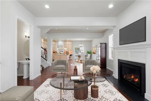 a living room with fireplace furniture and a fireplace
