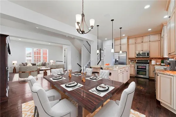 a dinning room and kitchen with a large window