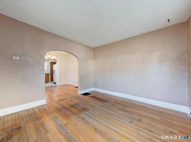 a bathroom with a toilet a sink and bathtub
