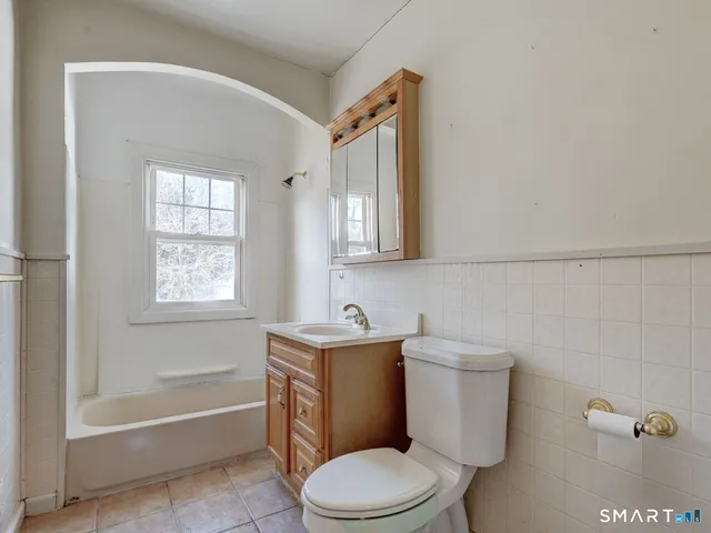 a view of a room with wooden walls