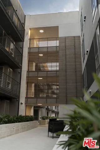 a front view of a building with a yard