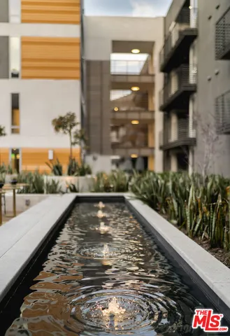 a view of a swimming pool with outdoor seating