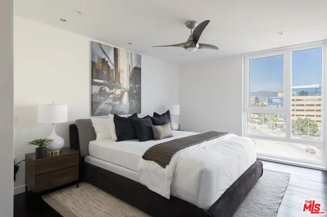 a bedroom with bed and window