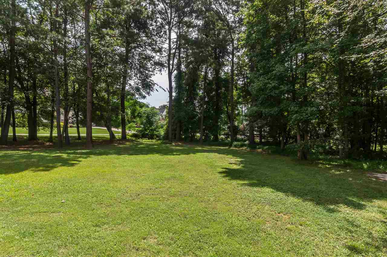1132 Rhea Drive Garner, NC 27529 - Photo 21 of 25 The .7 acre lot has something for everyone - ample lawn space to play, plus plenty of mature trees for privacy and shade. And it's located next to community-owned land! .7 acre Wooded Backyard