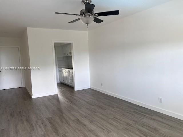 1350 East Sample Road, Unit 306 Pompano Beach, FL 33064 - Photo 12 of 13 wooden floor in an empty room