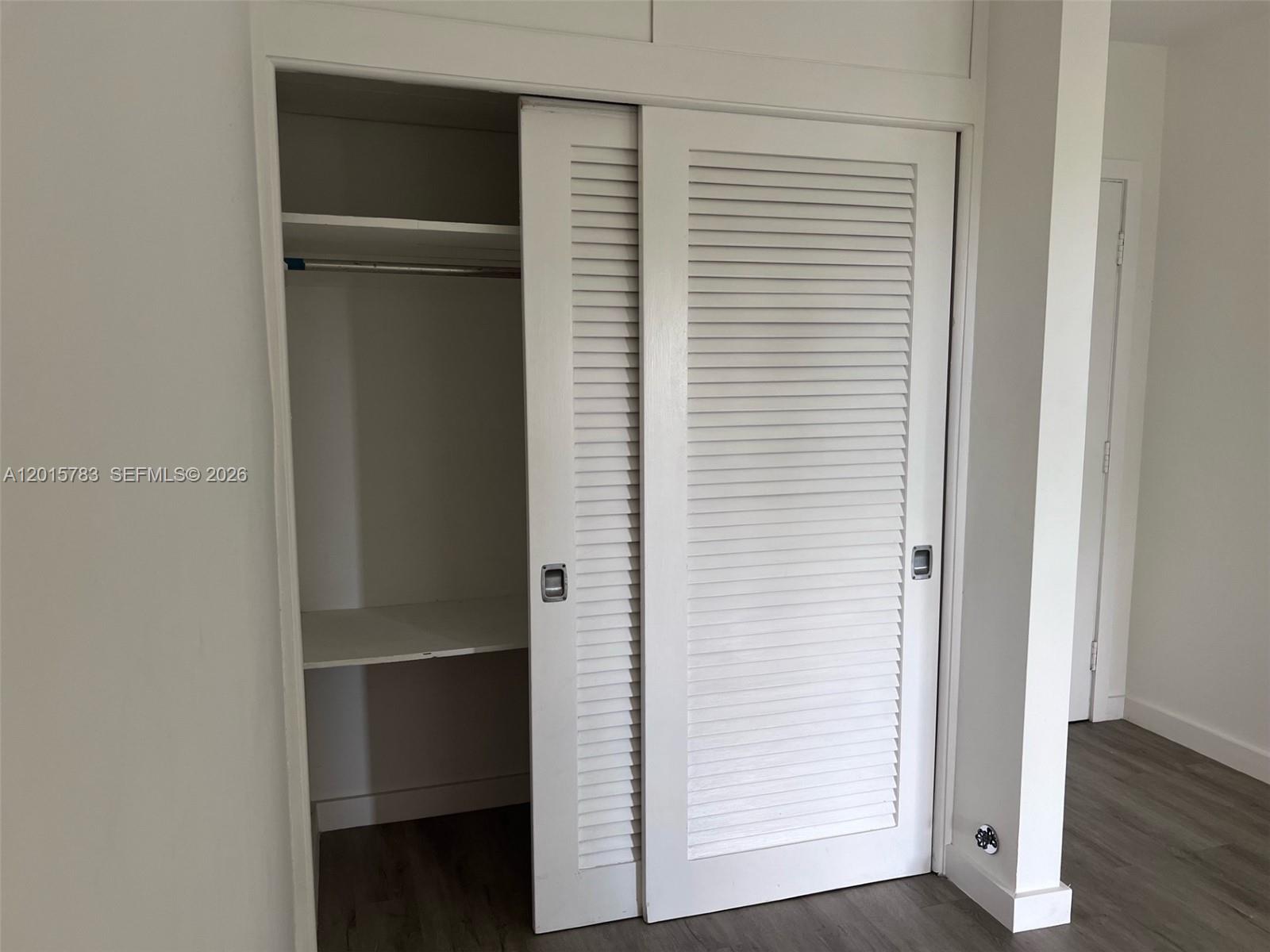 1350 East Sample Road, Unit 306 Pompano Beach, FL 33064 - Photo 13 of 13 a view of closet area with hallway