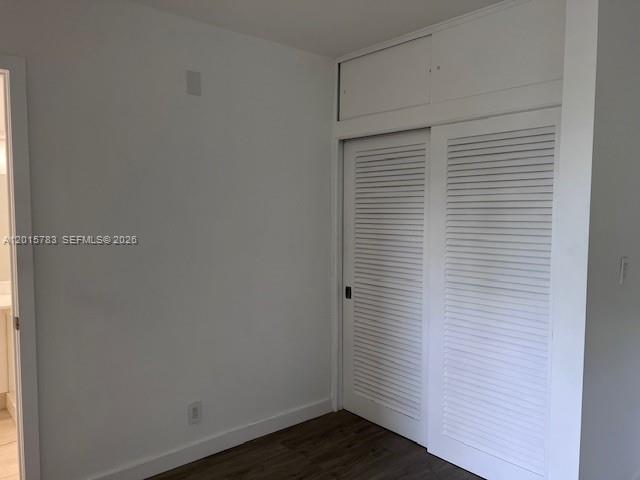 1350 East Sample Road, Unit 306 Pompano Beach, FL 33064 - Photo 7 of 13 a view of small space with wooden floor