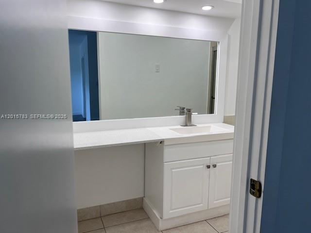 1350 East Sample Road, Unit 306 Pompano Beach, FL 33064 - Photo 9 of 13 a bathroom with a sink vanity and a mirror