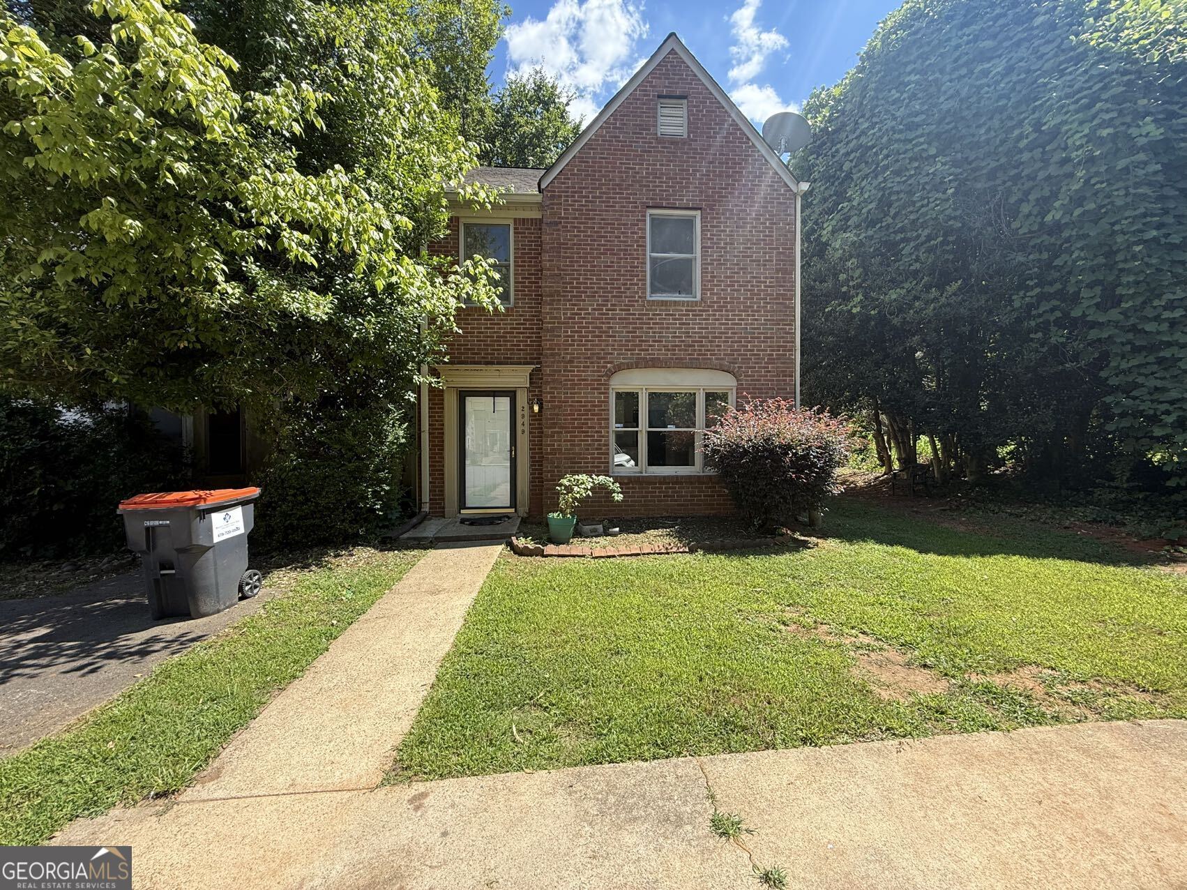 2949 Governors Court Marietta, GA 30066 - Photo 1 of 17 a front view of a house with a yard