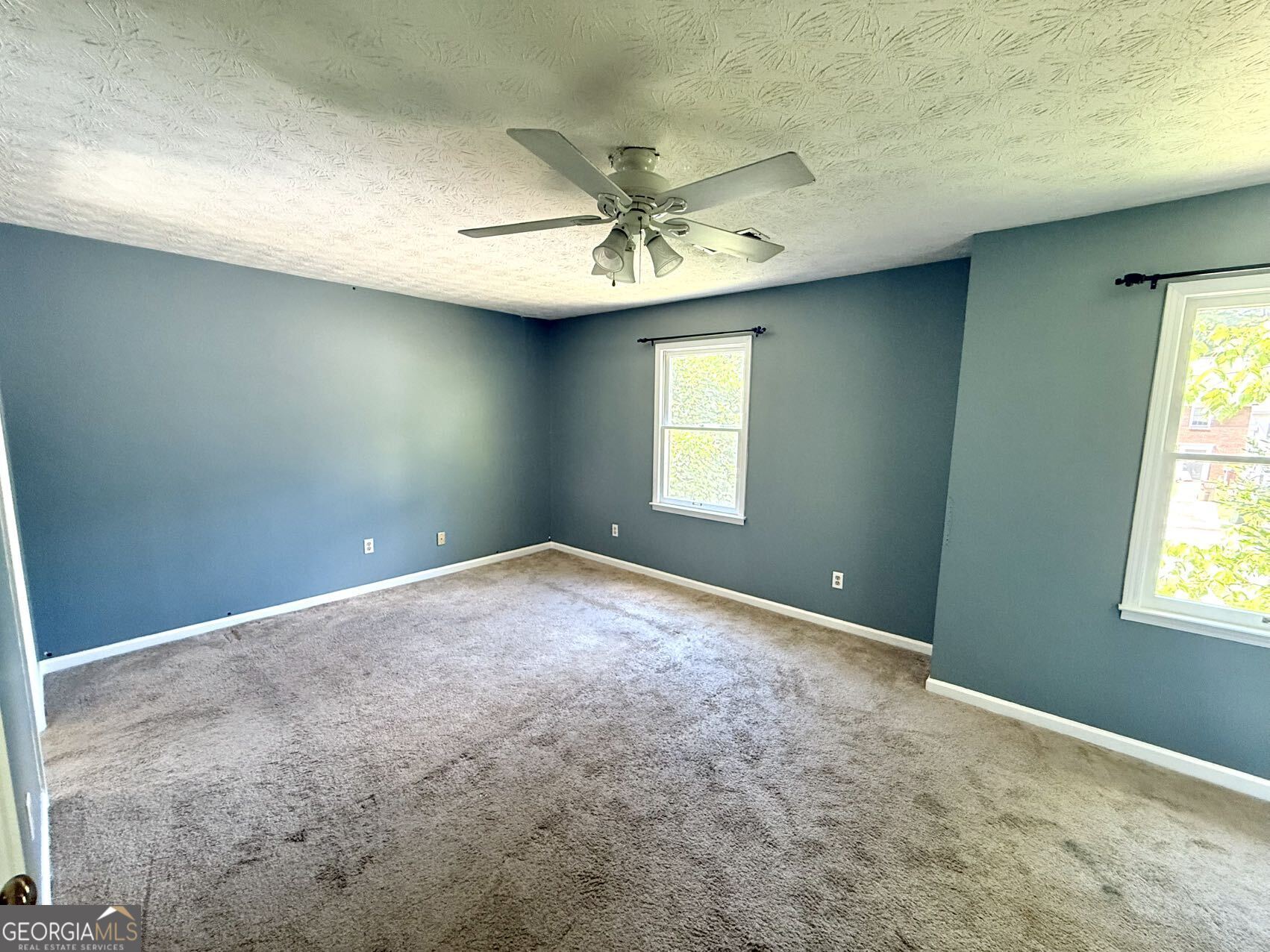 2949 Governors Court Marietta, GA 30066 - Photo 15 of 17 an empty room with windows and fan