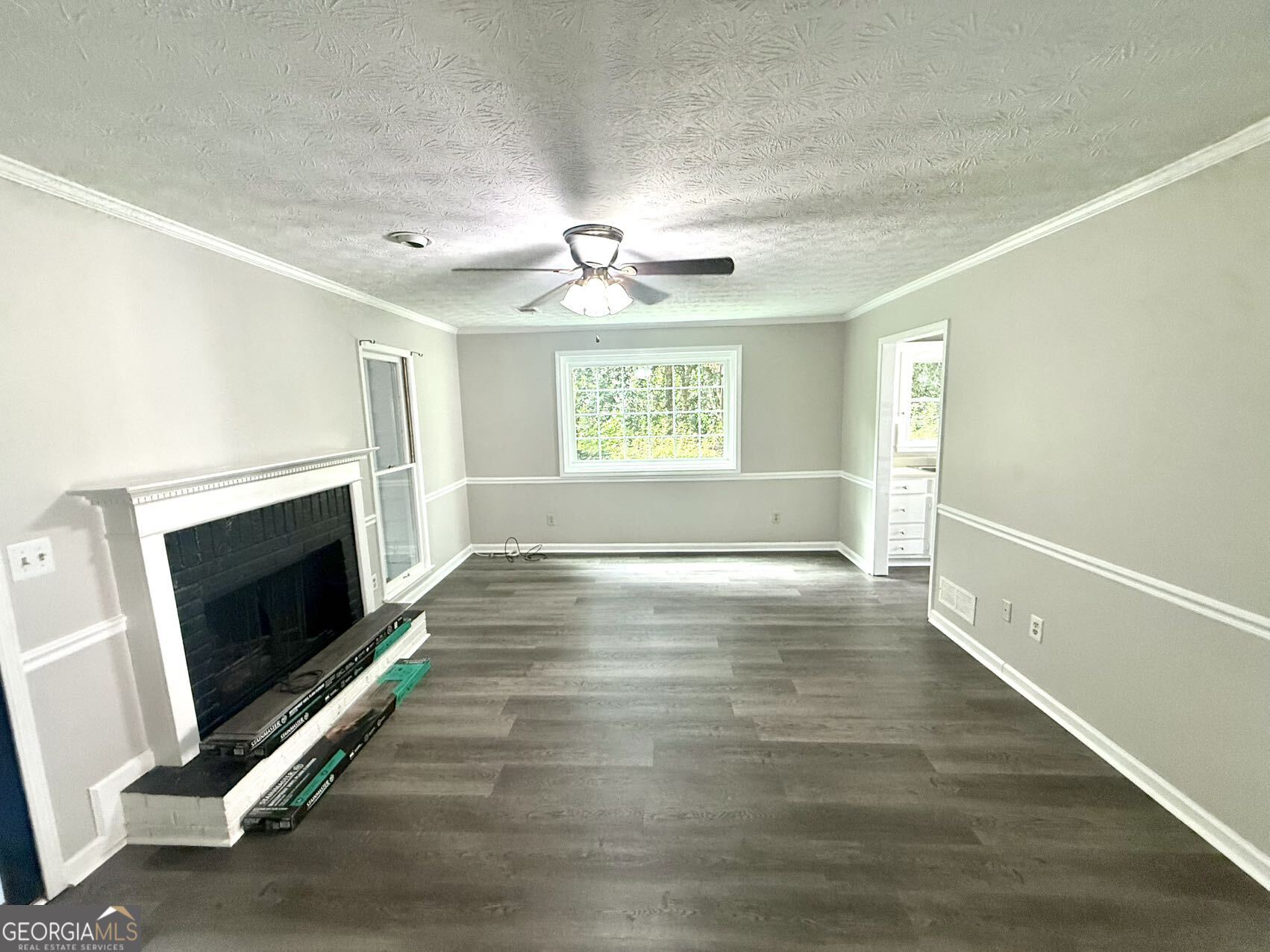 2949 Governors Court Marietta, GA 30066 - Photo 6 of 17 a view of an empty room with wooden floor and a window