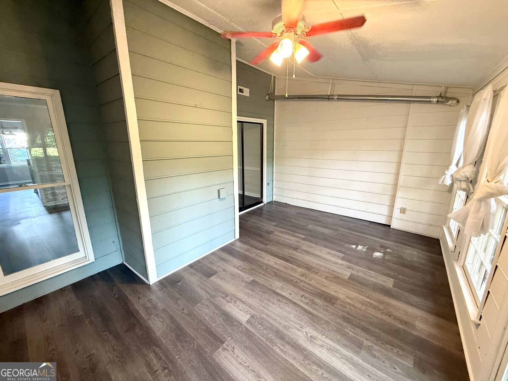 2949 Governors Court Marietta, GA 30066 - Photo 10 of 17 a view of empty room with wooden floor and fan