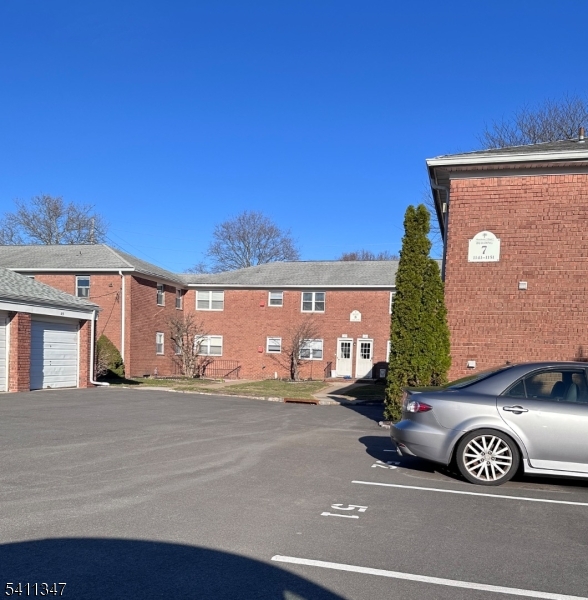 1163 Valley Road, Unit B Wayne, NJ 07470 - Photo 19 of 23 a front view of a house with a garage
