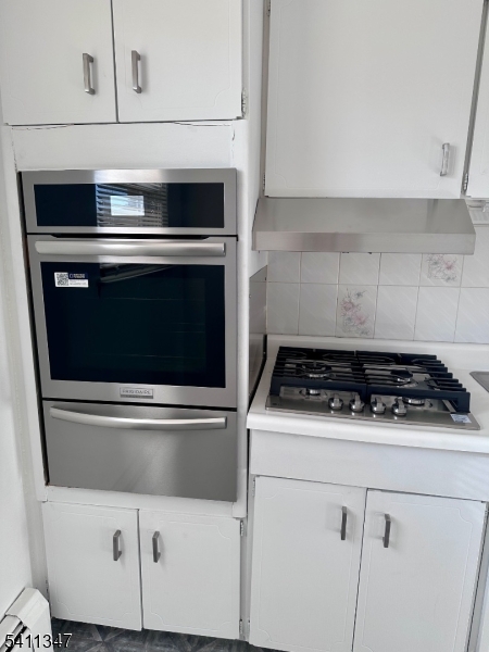 1163 Valley Road, Unit B Wayne, NJ 07470 - Photo 3 of 23 a stove top oven sitting inside of a kitchen