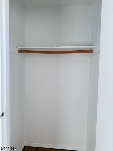 1163 Valley Road, Unit B Wayne, NJ 07470 - Photo 5 of 23 a view of a closet with wooden floor