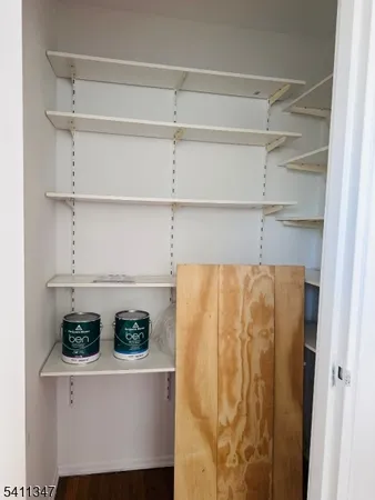 a close view of refrigerator a stove and cabinets