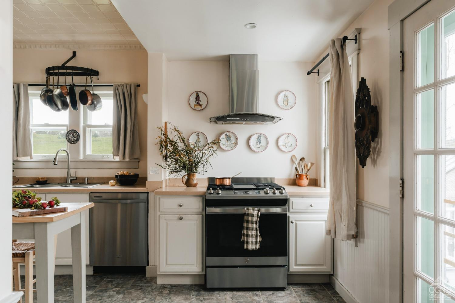 110 Stickle Road Hudson, NY 12534 - Photo 14 of 58 a kitchen with stainless steel appliances a stove a refrigerator and cabinets