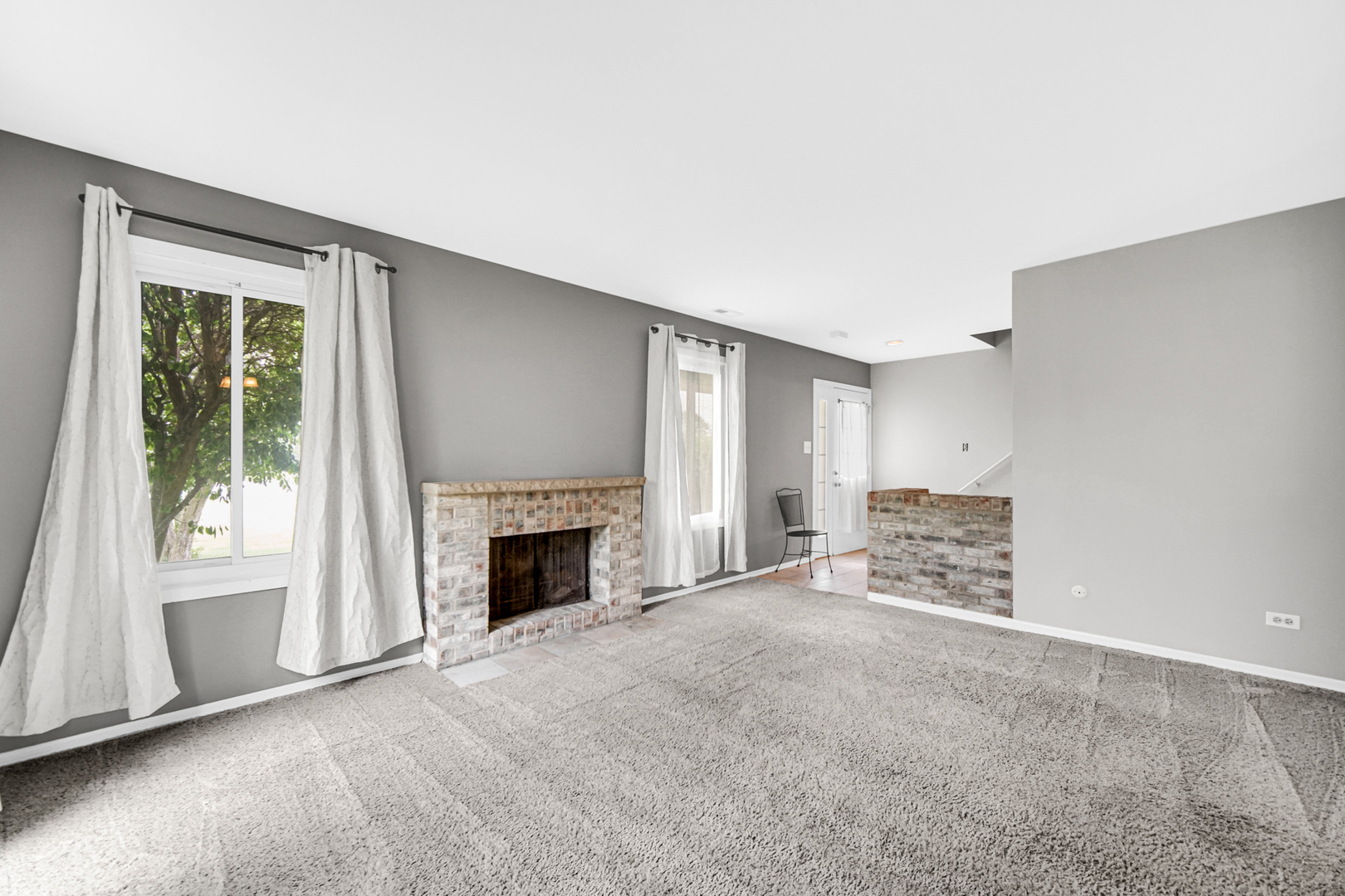 51 Churn Road Matteson, IL 60443 - Photo 11 of 20 an empty room with furniture and a fireplace