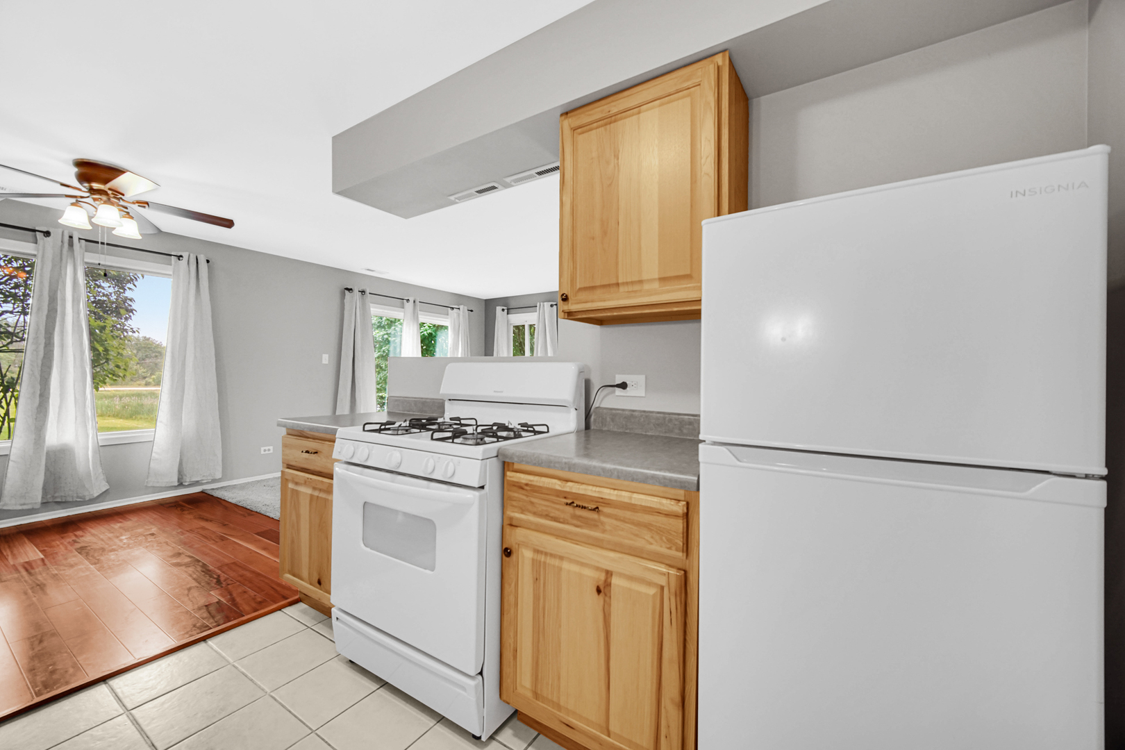 51 Churn Road Matteson, IL 60443 - Photo 16 of 20 a kitchen with a stove a refrigerator and a sink