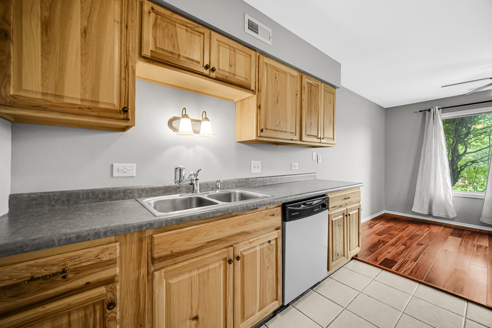 51 Churn Road Matteson, IL 60443 - Photo 17 of 20 a kitchen with stainless steel appliances granite countertop a sink dishwasher stove and cabinets