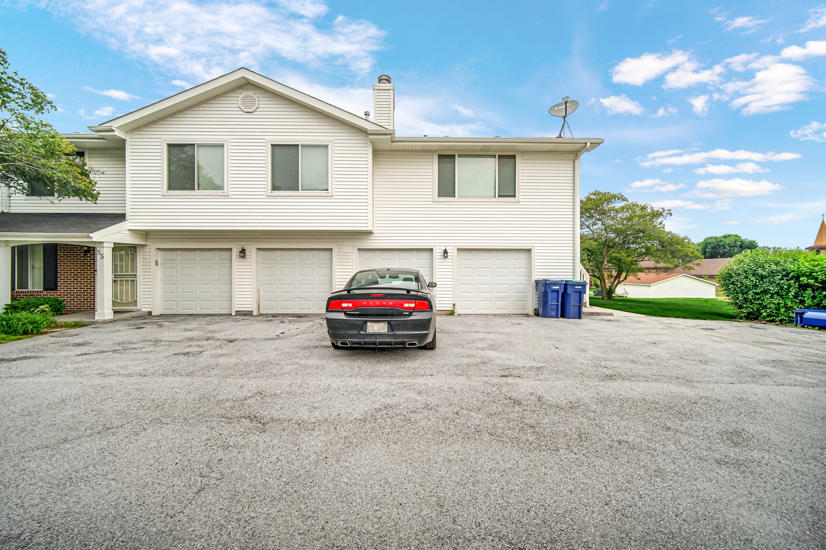51 Churn Road Matteson, IL 60443 - Photo 19 of 20 a view of a house with a yard and garage