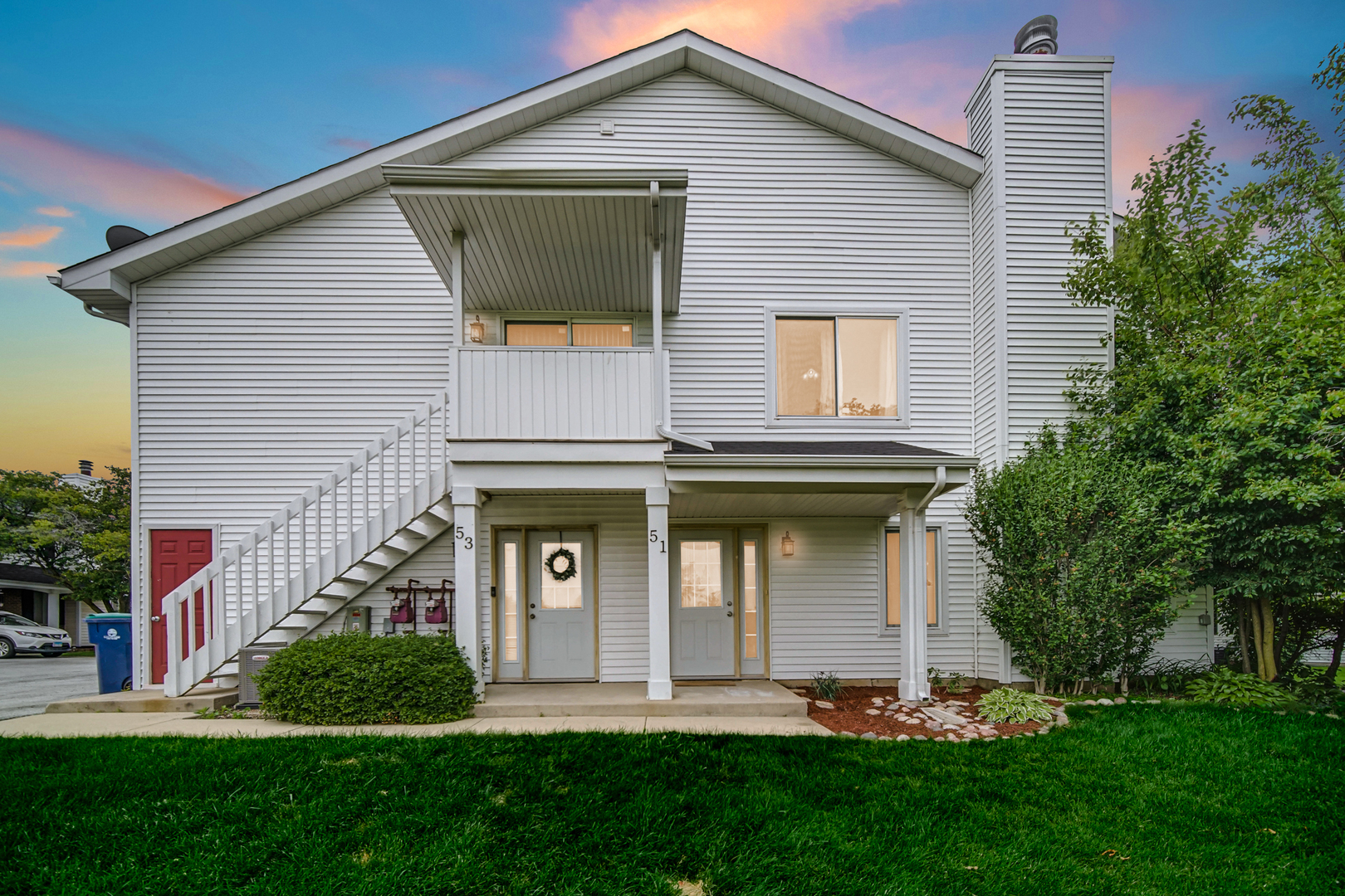 51 Churn Road Matteson, IL 60443 - Photo 2 of 20 a front view of a house with a yard and trees