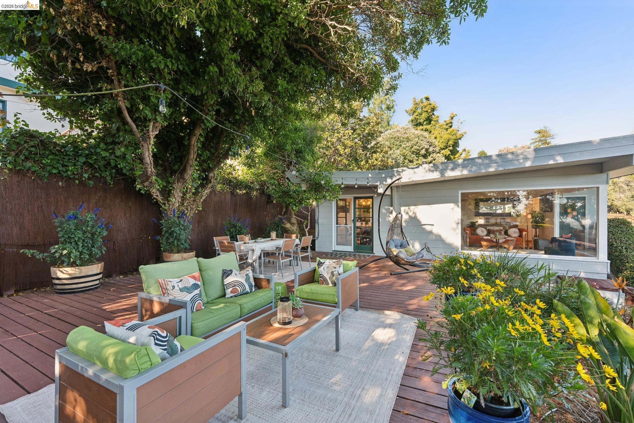 2301 Oak Street Berkeley, CA 94708 - Photo 32 of 61 Expansive outdoor deck featuring wood-finish flooring, a dining area, and a separate seating area