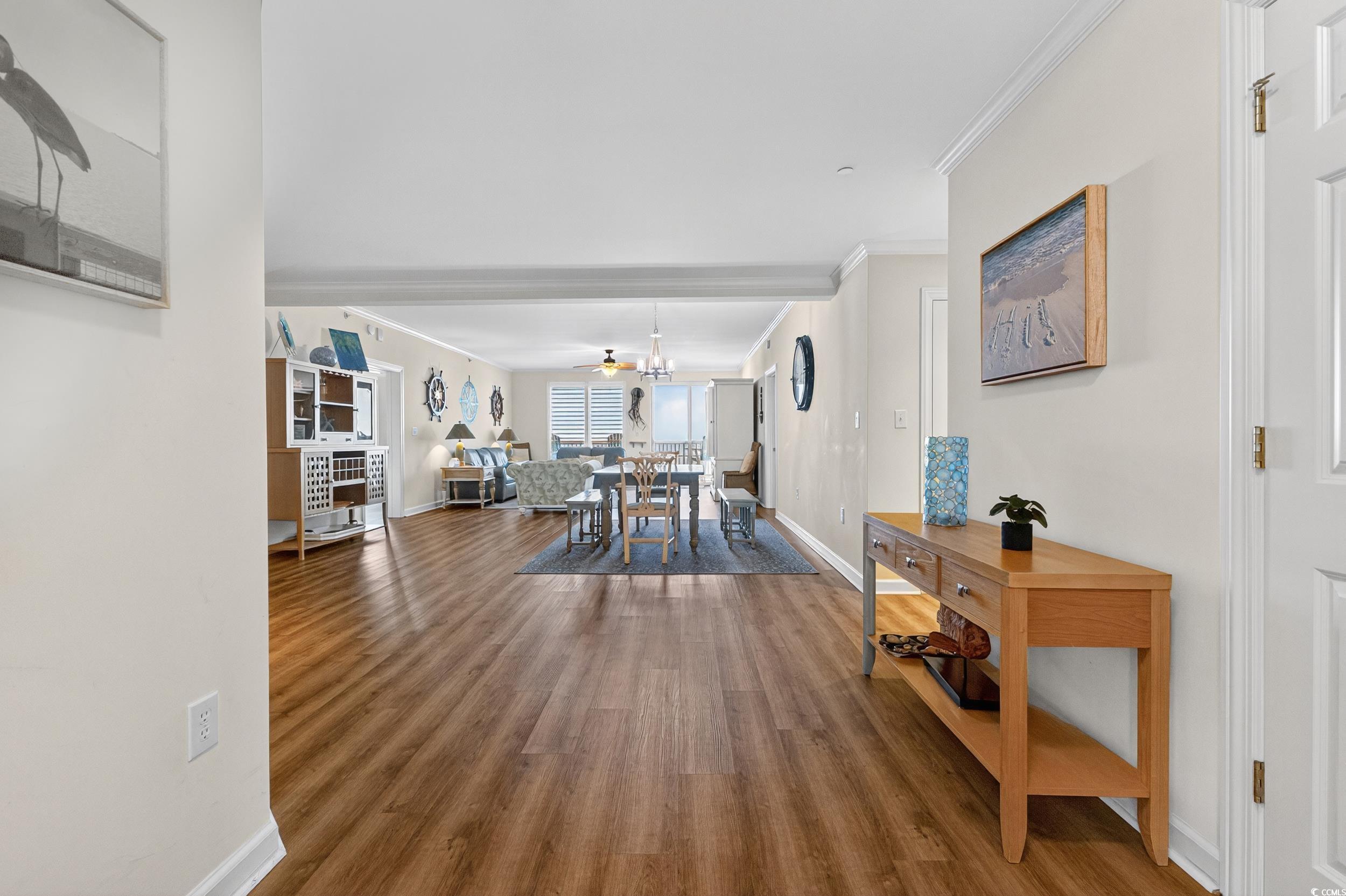 8500 Margate Circle, Unit 1104 Myrtle Beach, SC 29572 - Photo 4 of 40 Dining room featuring ornamental molding, wood finished floors, and a ceiling fan