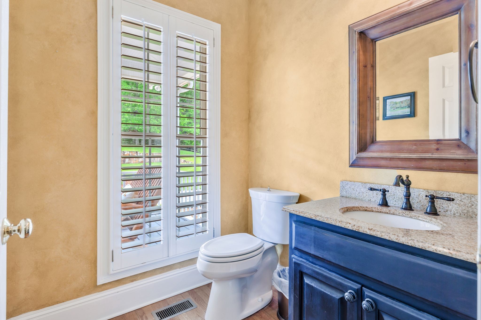 1036 Reed Hollow Road Readyville, TN 37149 - Photo 56 of 90 a bathroom with a toilet a sink and a mirror