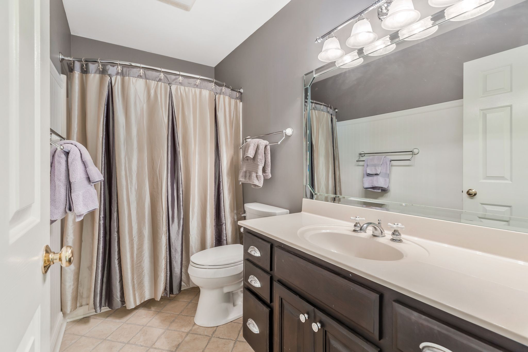 1036 Reed Hollow Road Readyville, TN 37149 - Photo 71 of 90 a bathroom with a sink a toilet and shower curtain