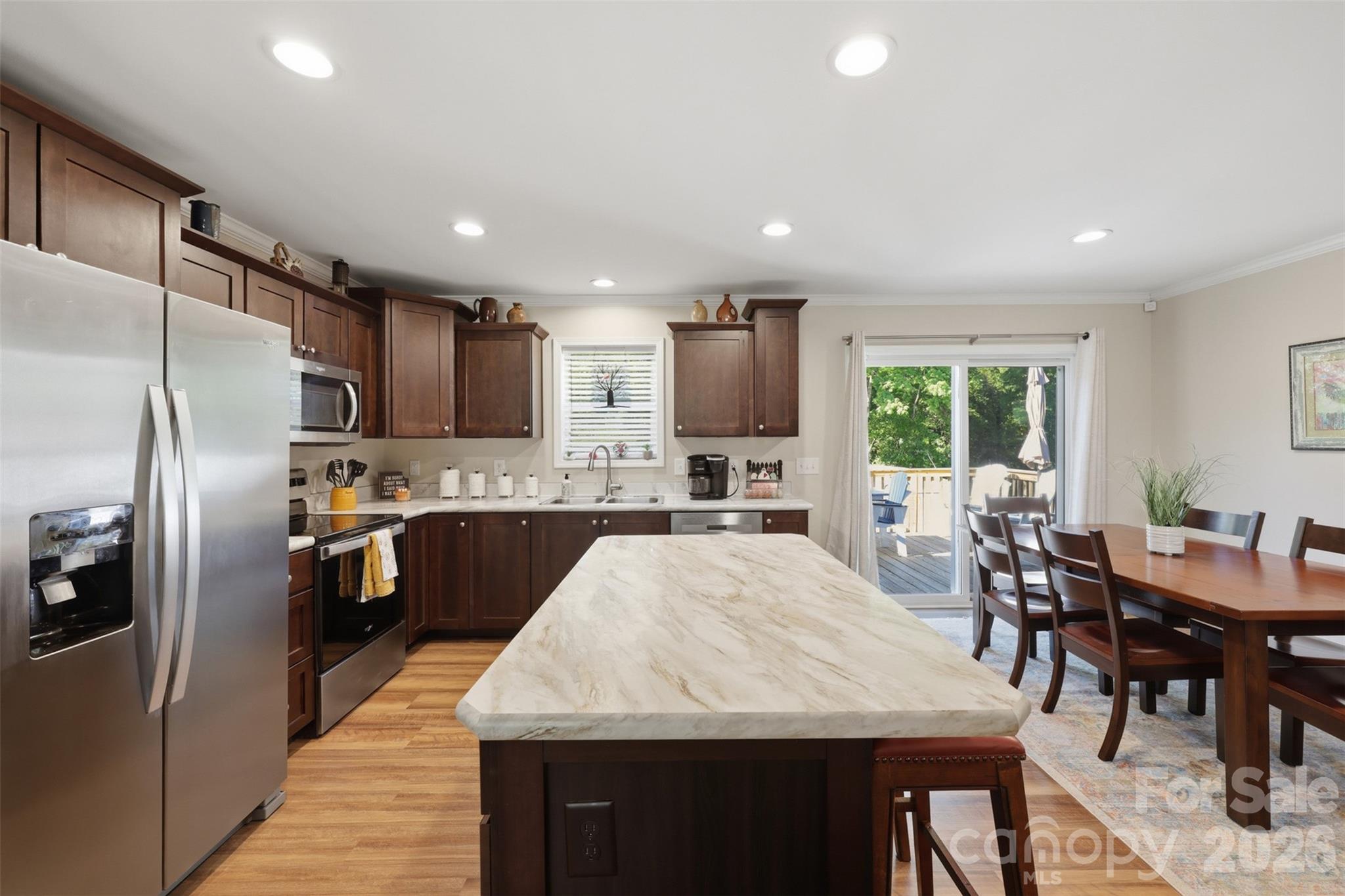 6591 George Hildebran School Road Hickory, NC 28602 - Photo 12 of 41 a large kitchen with kitchen island a large island in the center