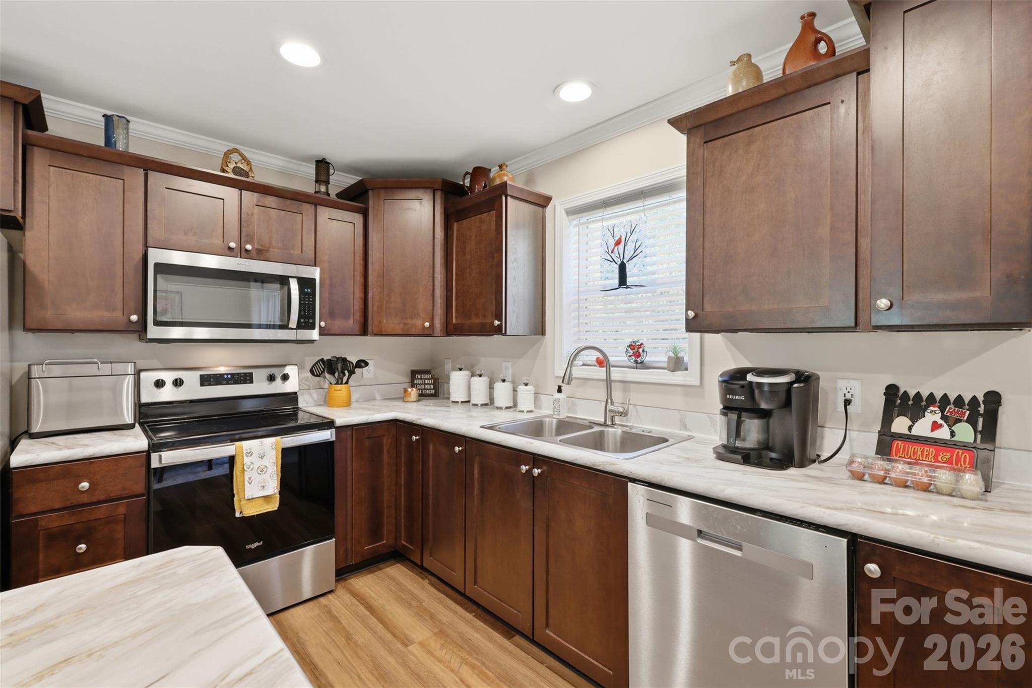 6591 George Hildebran School Road Hickory, NC 28602 - Photo 13 of 41 a kitchen with stainless steel appliances granite countertop a sink stove and microwave