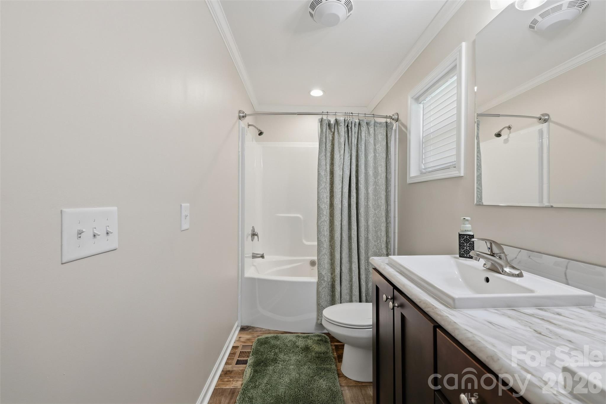 6591 George Hildebran School Road Hickory, NC 28602 - Photo 23 of 41 a bathroom with a sink toilet and shower