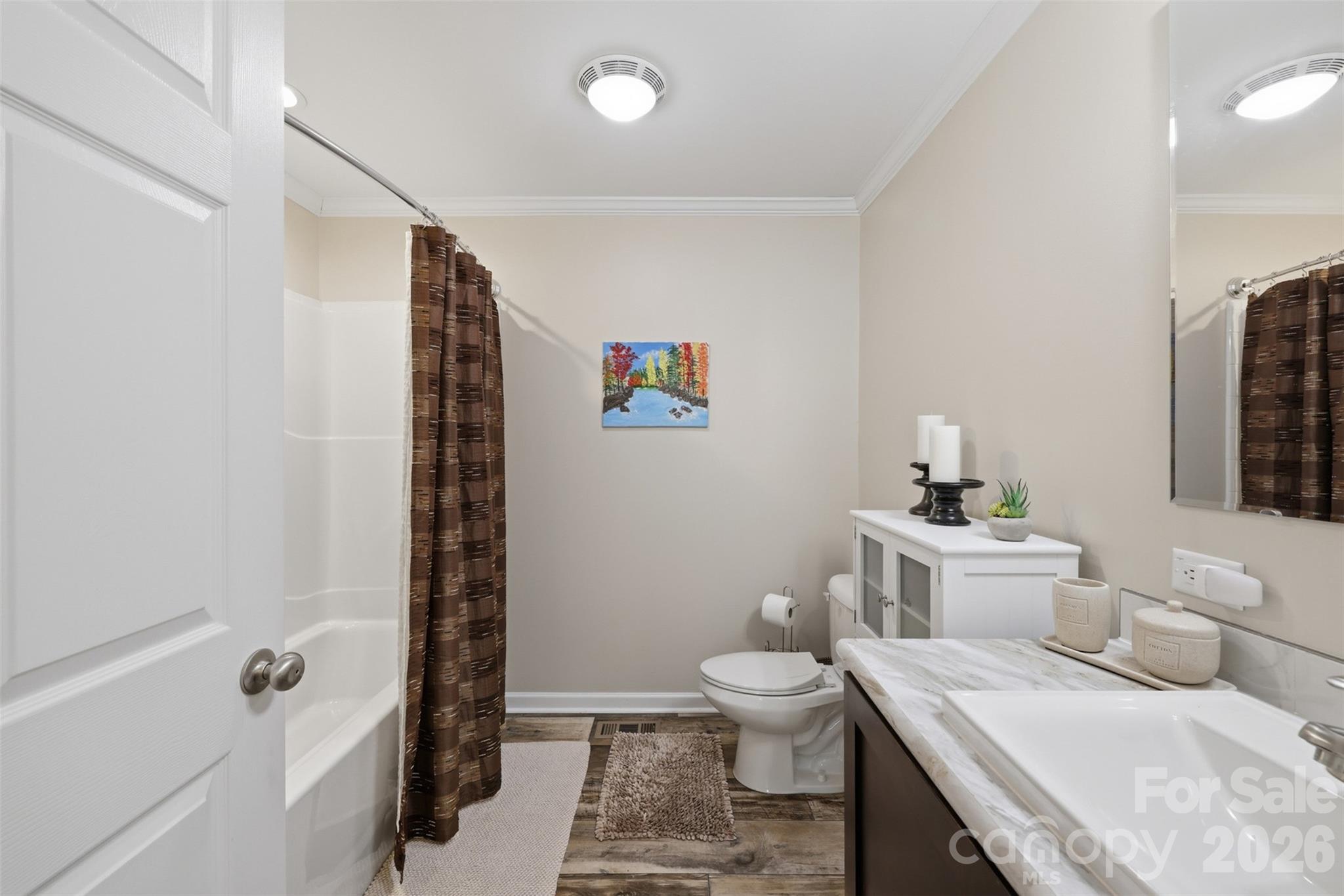 6591 George Hildebran School Road Hickory, NC 28602 - Photo 29 of 41 a bathroom with a sink a toilet and shower curtain