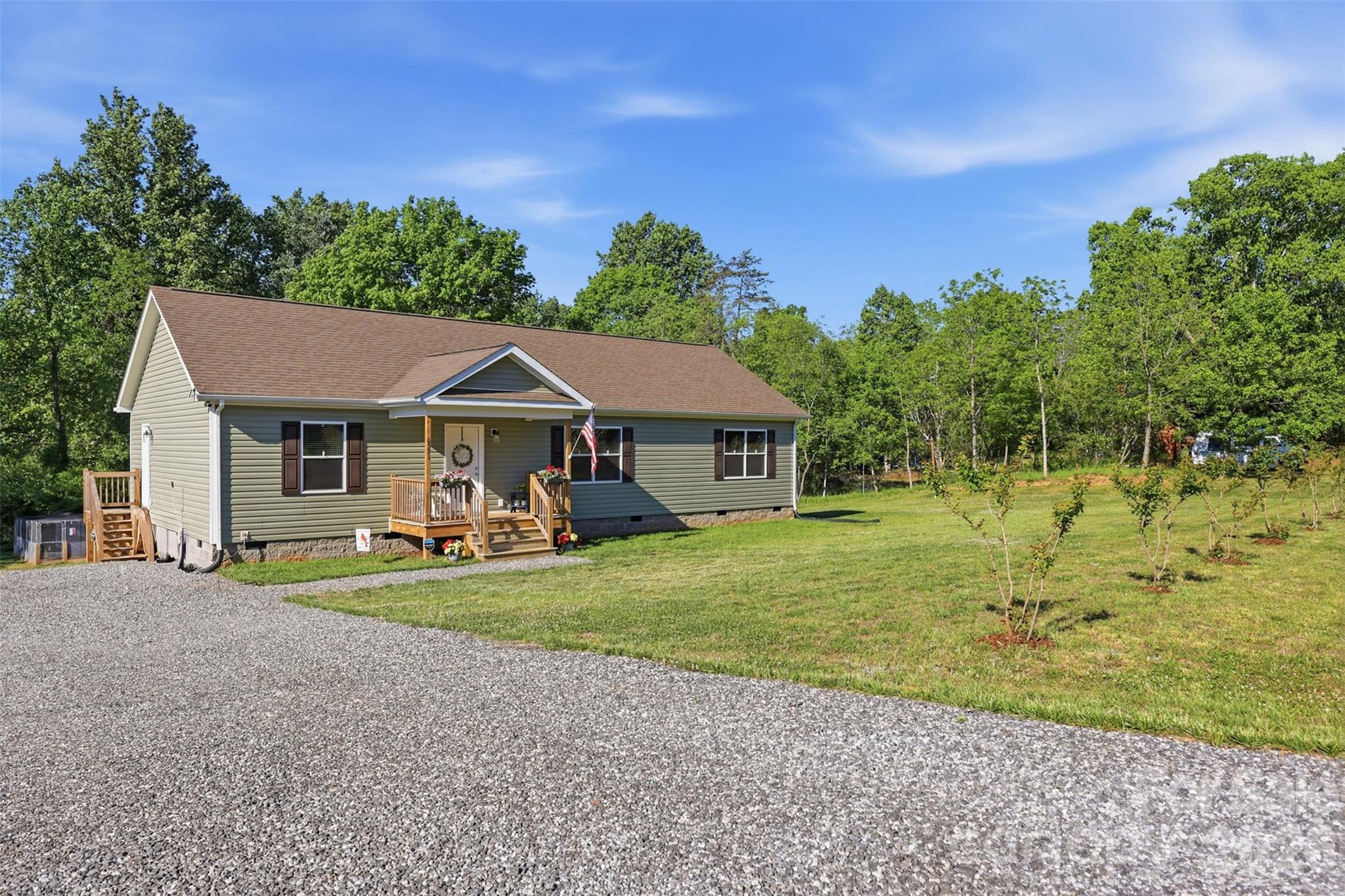 6591 George Hildebran School Road Hickory, NC 28602 - Photo 36 of 41 a front view of a house with garden