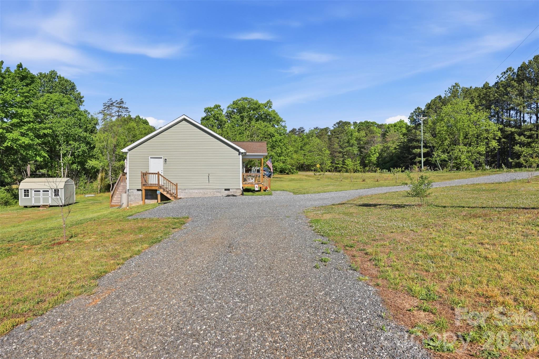 6591 George Hildebran School Road Hickory, NC 28602 - Photo 41 of 41 a view of a house with a yard and a garage