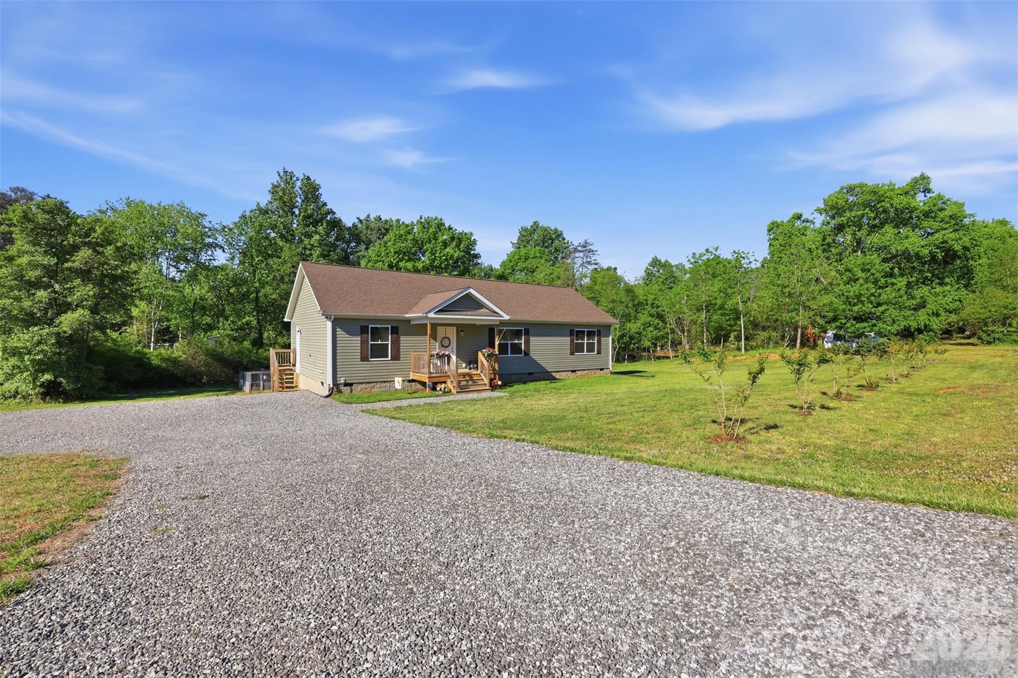 6591 George Hildebran School Road Hickory, NC 28602 - Photo 6 of 41 a front view of a house with a yard