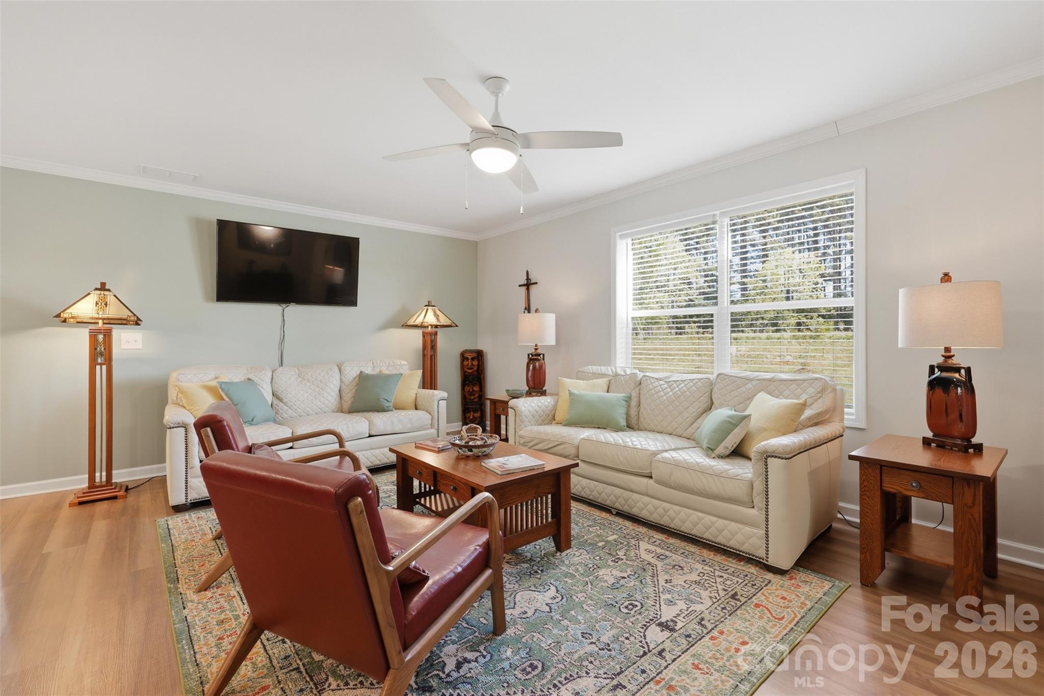 6591 George Hildebran School Road Hickory, NC 28602 - Photo 8 of 41 a living room with furniture a flat screen tv and a large window