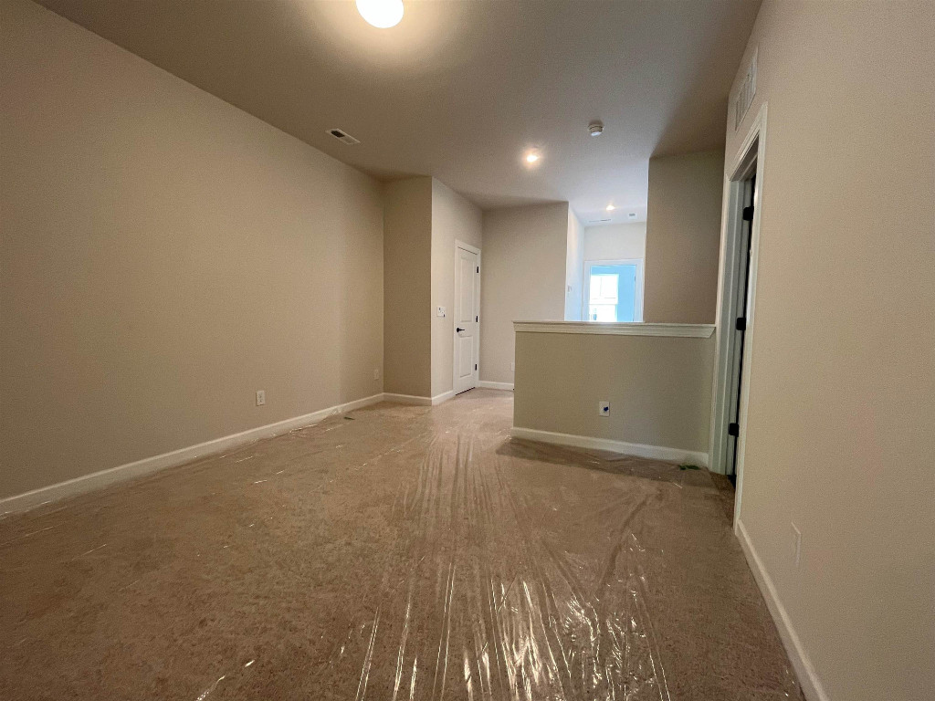 Undisclosed Address Raleigh, NC 27617 - Photo 11 of 37 an empty room with wooden floor and windows